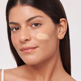 Alastin HydraTint Pro Mineral Broad Spectrum Sunscreen SPF 36 being applied to the skin